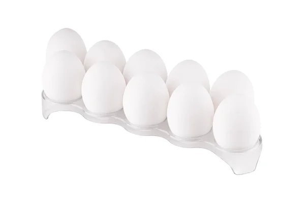 Aislado en la pila blanca de huevos de gallina en el soporte de plástico. —  Fotos de Stock