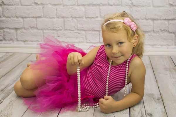 Child in a pink dress — Stock Photo, Image