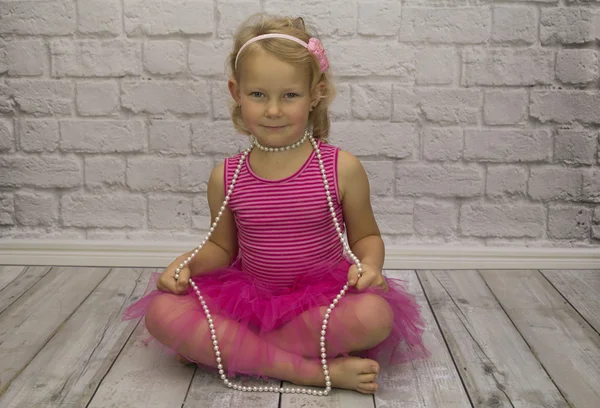 Child in a pink dress — Stock Photo, Image