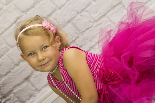 Child in a pink dress — Stock Photo, Image