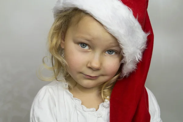 Kleine st. nikolaus in roter mütze lizenzfreie Stockfotos