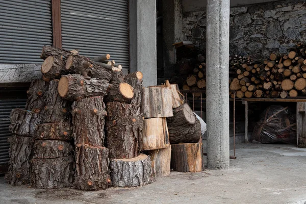Piles of fire hardwood for a fireplace for heating during wintertime. — Stock Image Piles of fire hardwood for a fireplace for heating during wintertime. Royalty Free Stock Images