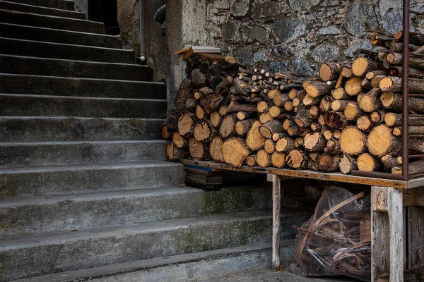 Piles of fire hardwood for a fireplace for heating during wintertime. — Stock Image Piles of fire hardwood for a fireplace for heating during wintertime. Royalty Free Stock Photos