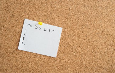 White paper on a cork board