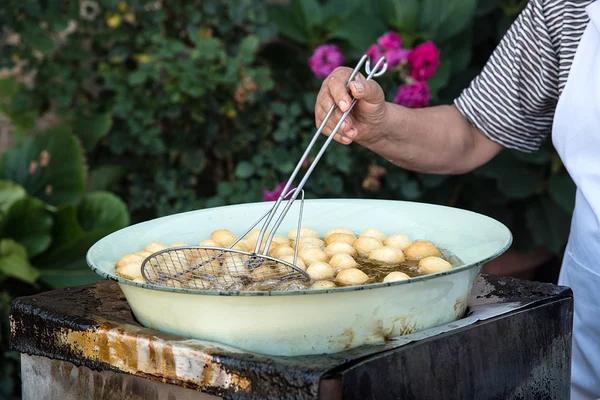 Woman cooking delicious  loukoumades pastry — Stock Photo, Image