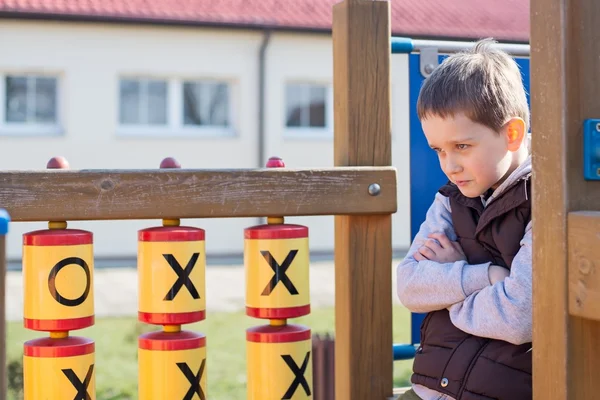 Offended boy on the playground — Stock Photo, Image