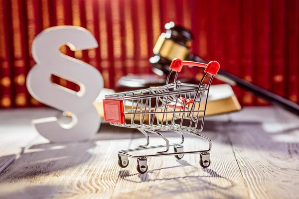 Little trolley - pushcart with the symbols of law — Stock Photo, Image