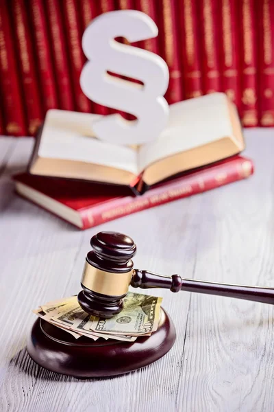 Gavel and american dollars in court library — Stock Photo, Image