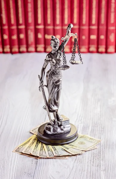 Statuette of Themis and american dollars — Stock Photo, Image