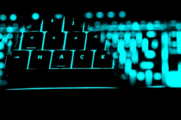 Hack text on the illuminated buttons of the keyboard — Stock Photo, Image