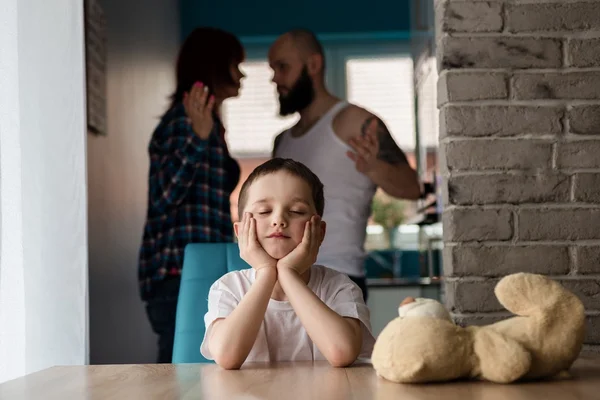 Sad, desperate little boy during parents quarrel — Stock Photo, Image