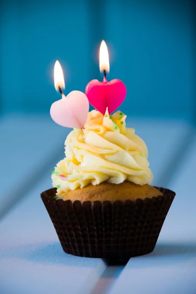 Cupcake with a heart shaped candles for 2 - second birthday — Stock Photo, Image