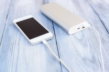 Powerbank charging white smartphone clipart