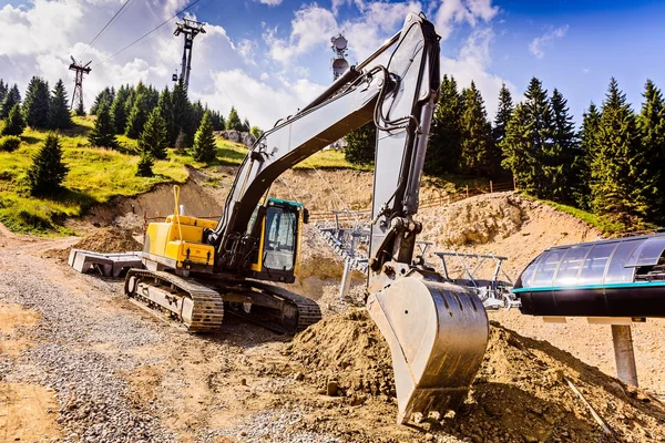 Yellow excavator on tracks — Stock Photo, Image