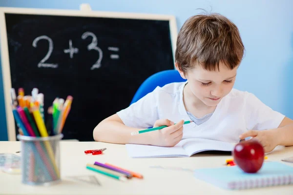 Child doing his homework — Stock Photo, Image