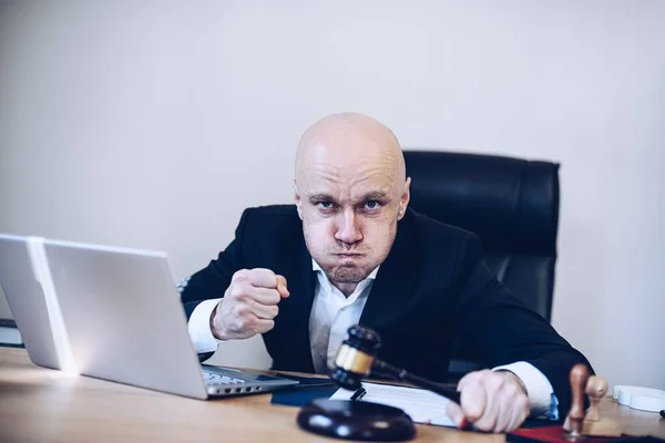 Furious notary public with a gavel in hand in his notarys office. — Stock Photo, Image