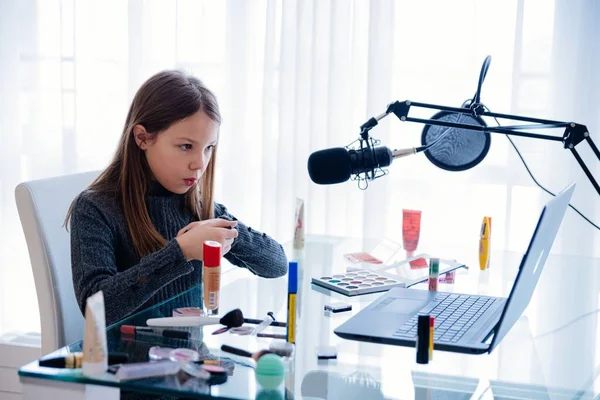 Young beauty cosmetic blogger recording video for blog her blog.