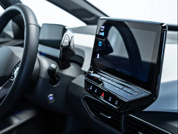 Modern electric car interior and dashboard with monitors — Stock Photo, Image