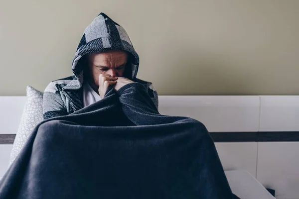 Young man having depression sitting on the bed. — Stock Photo, Image