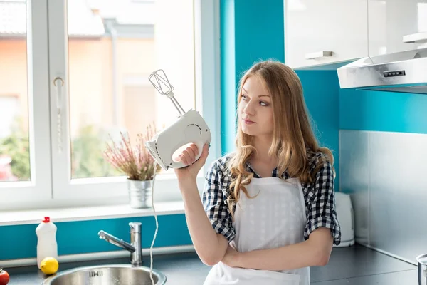 Woman holding hand mixer — Stock Photo, Image