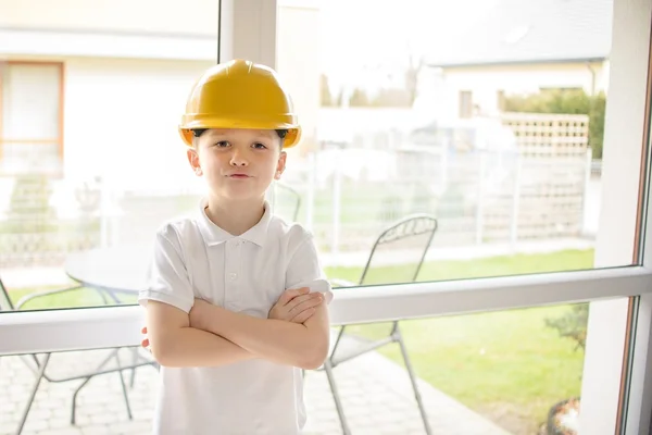 Little boy wearing a engineering helmet — Stock Photo, Image