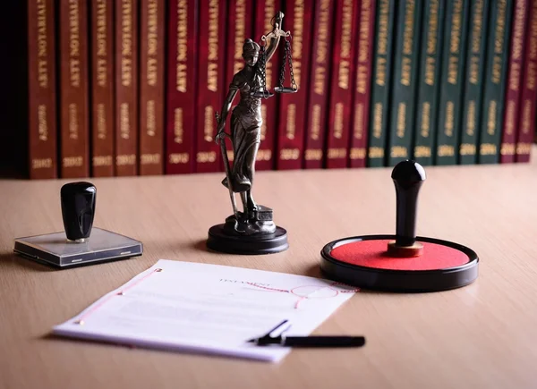 Document waiting for a notary public sign on desk