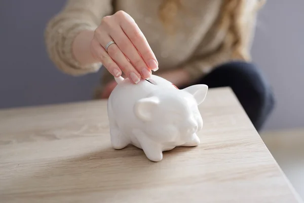 Closeup of a woman's hand inserting a coin — Stock Photo, Image