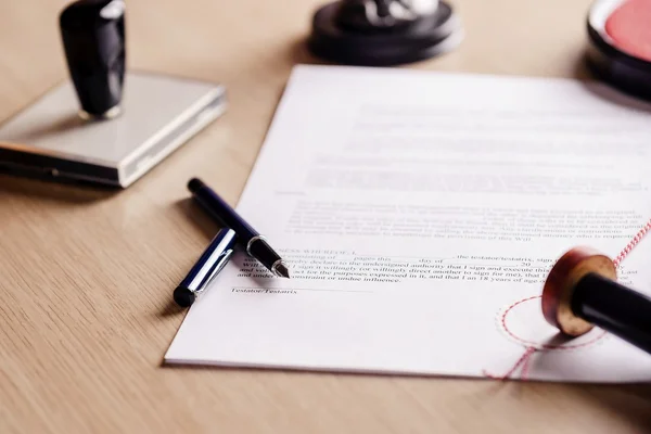 Notary pen lying on testament. — Stock Photo, Image