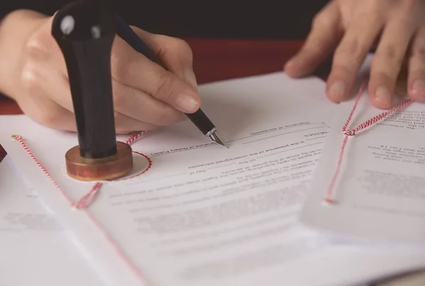 Close up on notaries public hand signing the testament — Stock Photo, Image