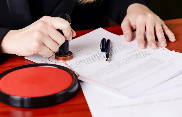 Close up on notaries  public hand stamping the testament — Stock Photo, Image