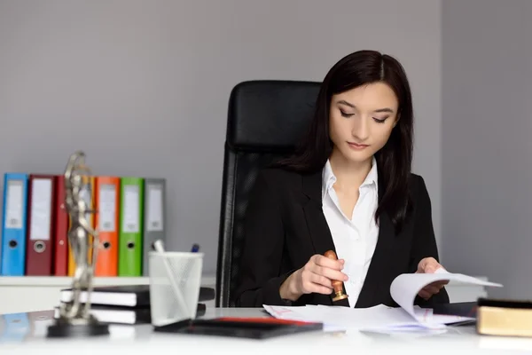 Notary public stamping document with ink stamper. — Stock Photo, Image