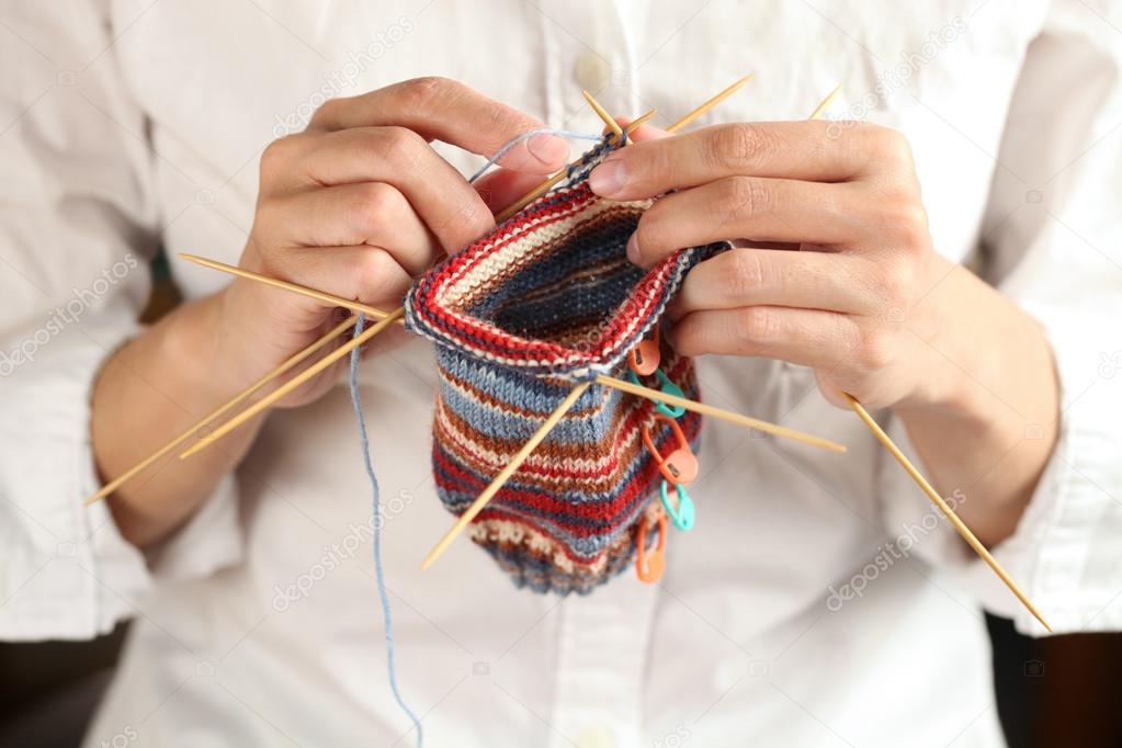 Close up of woman hands knitting