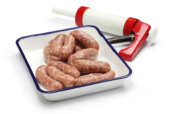 Raw sausage and sausage maker — Stock Photo, Image