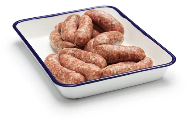 Raw sausage in butcher tray — Stock Photo, Image