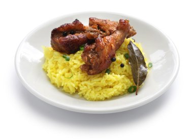 chicken and pork adobo over yellow rice, filipino food