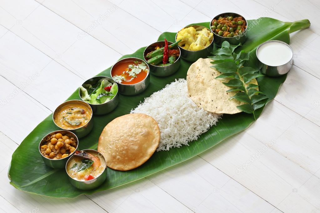 South indian meals served on banana leaf — Stock Photo © asimojet #79501064