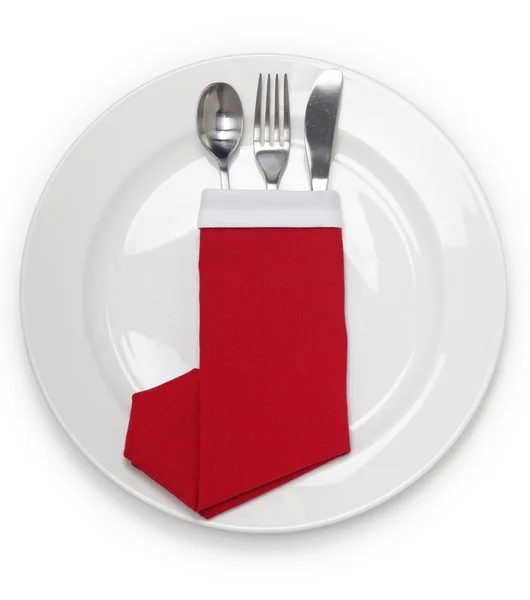 Christmas dinner, napkin folded as a santa claus boots — Stock Photo, Image