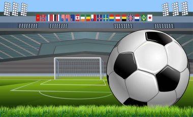 Klasik futbol topu, tipik siyah-beyaz desenli, stadyumun futbol sahasına yerleştirilmiş. Geleneksel futbol topu yeşil çimenlik alanda.