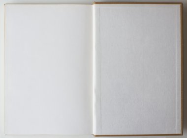 Blank book opened to the first page. clipart