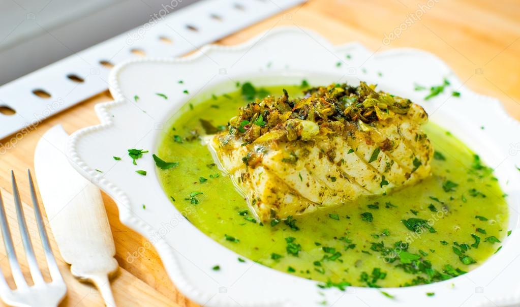 Codfish in green sauce. — Stock Photo © photooiasson 59476755