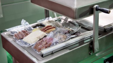 Automatic heat vacuum sealing package machine for food packaging product clipart