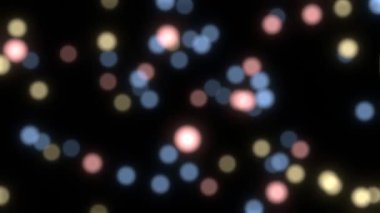 Renkli parçacıklar arka plan bokeh. Hareketli ışık soyutlaması. Odaklanmamış pembe parçacıklar arkaplanı
