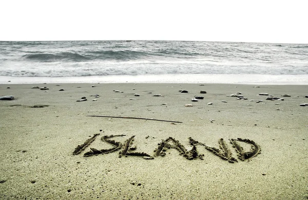 Ön skriven i sand på stranden — Stockfoto