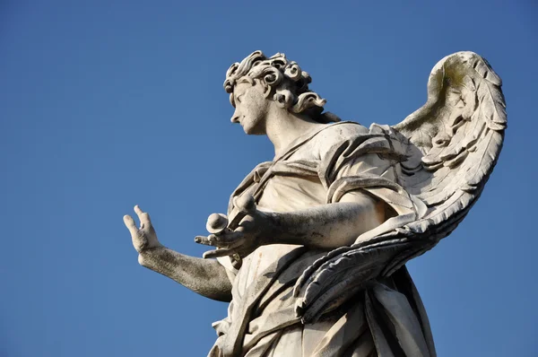 Ангел с гвоздями. Statue on the Ponte Sant 'Angelo bridge, R — стоковое фото