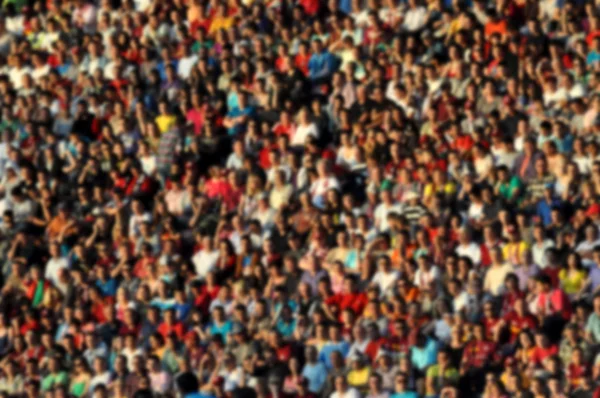 Blurred crowd of spectators in a stadium — Stock Photo, Image