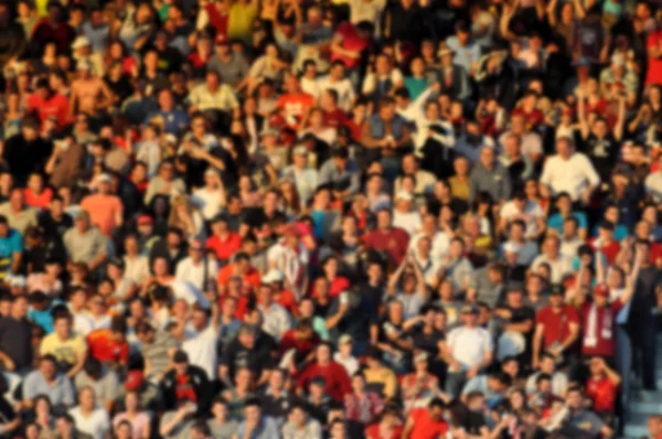 Blurred crowd of spectators in a stadium — Stock Photo, Image