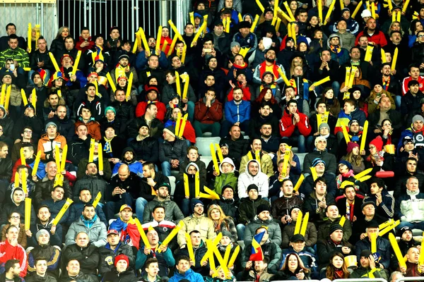 Crowd of people, supporters in a stadium during a football match — Stock Photo, Image