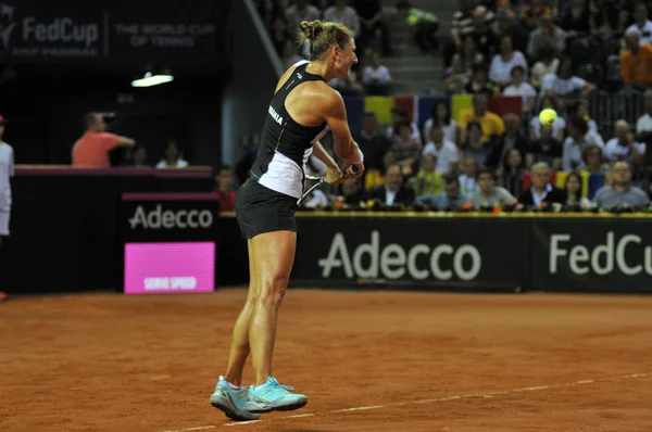 Mulher jogador de tênis em ação — Fotografia de Stock