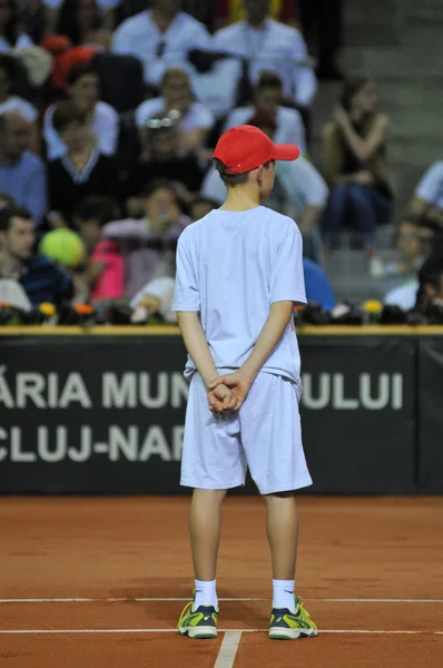 Ball boy in action during a tennis match — Stock Photo, Image