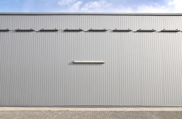 Sheet metal, corrugated wall building — Stock Photo, Image